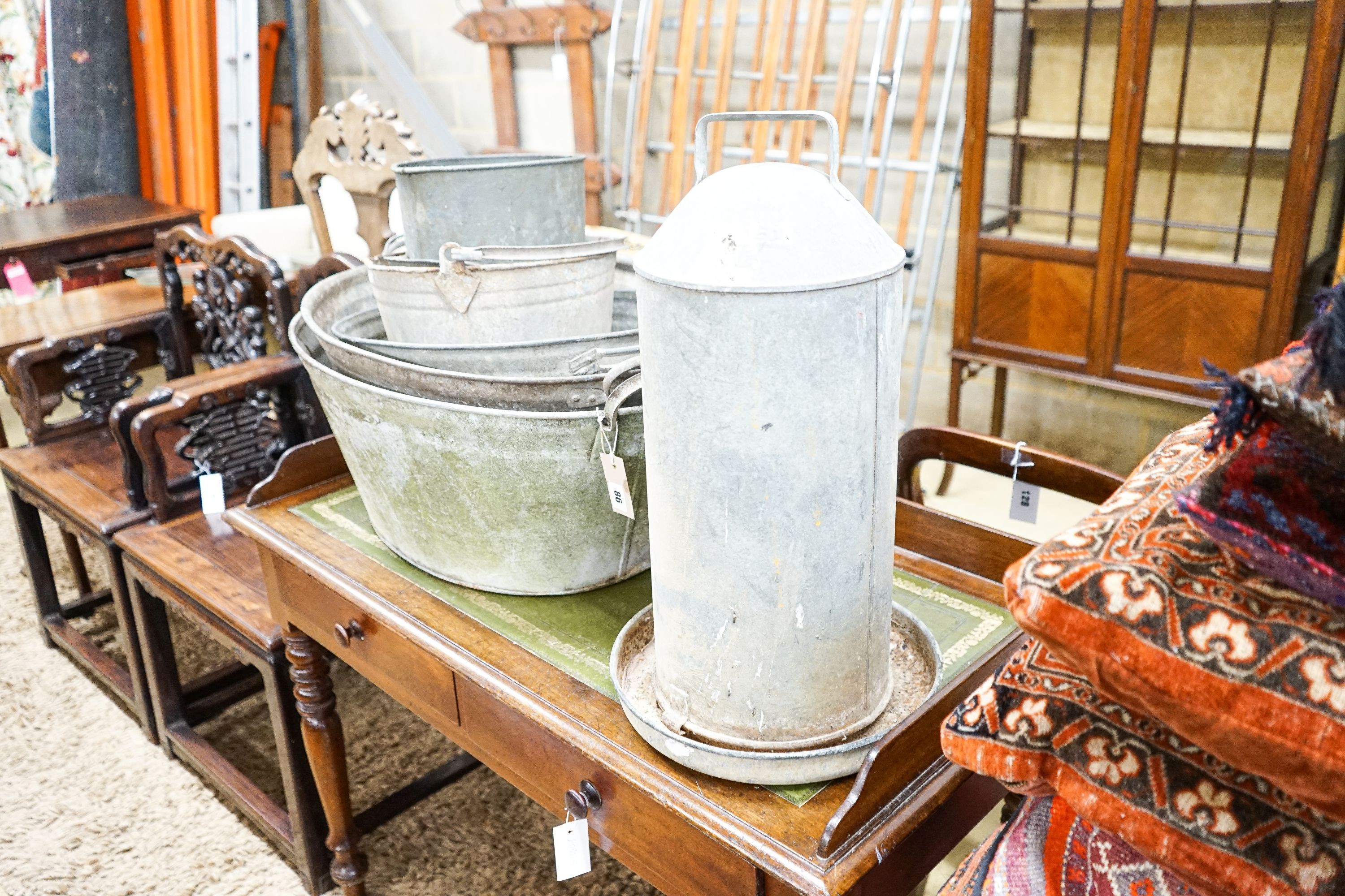 Five galvanised containers and a chicken feeder, largest 84cm